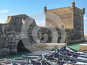 Harbour with old portugese buildings against a blue sky