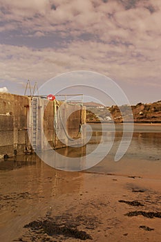 Harbour sea wall at Porth Nefyn, Gwynedd, North Wales.