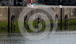 Harbour Wall with Bollards and Old Tyre Buffers photo