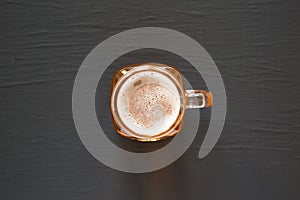 Hard Apple Cider Ale in a Glass Jar Mug on a black background, top view. Flat lay, overhead, from above