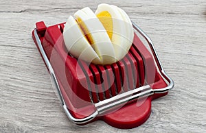 Hard boiled egg slicer tool. Household device for slicing egg