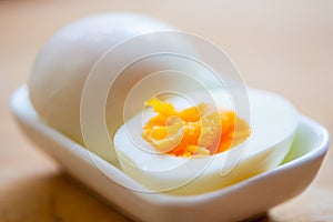 Hard boiled egg in a small dish