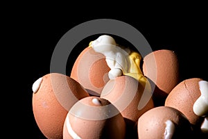 Hard boiled eggs erupted from pierced and cracked shells. photo