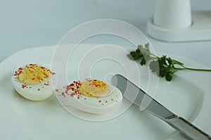 Hard boiled eggs sliced halves isolated white background