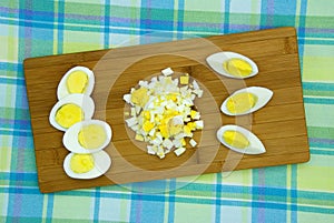 Hard boiled eggs on a wooden board