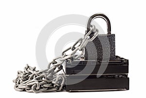 Hard disk, chain and padlock on a white background. The lock is locked