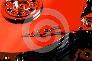 The hard disk from the computer HDD is red, with a mirror effect. The hard drive from the computer has opened