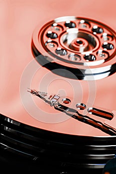 The hard disk from the computer HDD is red, with a mirror effect. The hard drive from the computer has opened