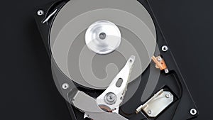 Hard disk drive inside with rotating platter and arm