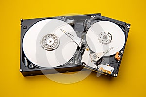 Hard disk drive and open cover. Computer hardware, hard disk, storage device. Detail of the inside of a hard disk drive. Hard disk