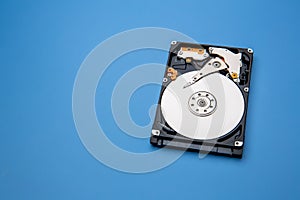 Hard disk drive and open cover. Computer hardware, hard disk, storage device. Detail of the inside of a hard disk drive. Hard disk