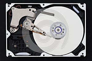 Hard disk drive with removed cover, hdd inside flat view, spindle, actuator arm, read write head, platter, ribbon cable