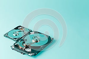 Hard disk drives opened on a blue background