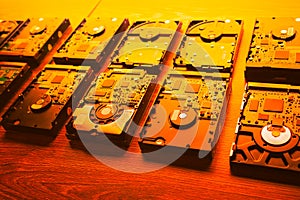 Hard disk drives in a rows, orange tone