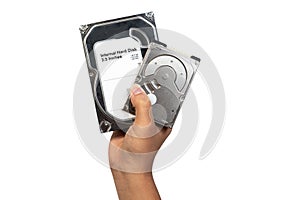 Hard disk Internal SATA and ATA 3.5 and 2.5 inches holding on technician man isolated on white background. Hand and computer hard