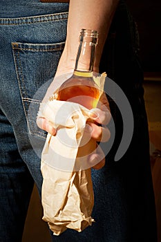 Hard drinker hides a bottle photo