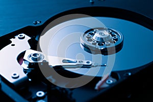 Hard drive close up. Blue tinted. Disassembled PC hard drive