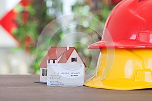 Hard hat on behalf of migrant workers, small house on behalf of hometown and a return train ticket.The Chinese characters on the t