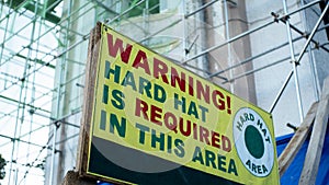 Hard hat warning sign in construction area