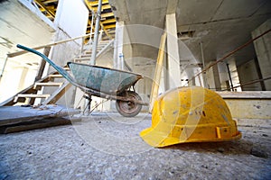 Hard hats and cart on concrete floor