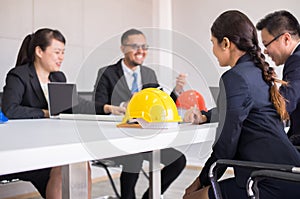 Hard hats safety helmet in meeting room,Blured of people architect and engineer at office