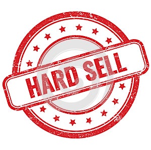 HARD SELL text on red grungy round rubber stamp