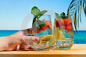 Hard seltzer cocktail on tropical beach.