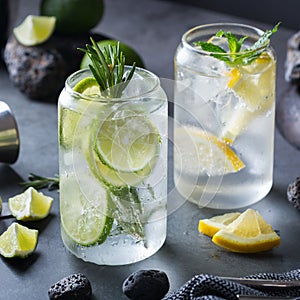 Hard seltzer cocktails with lime and lemon and bartenders accessories