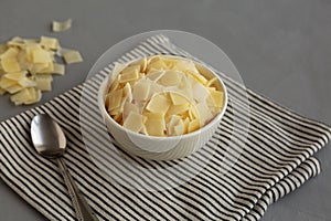 Hard Shaved Parmesan Cheese in a Bowl, side view