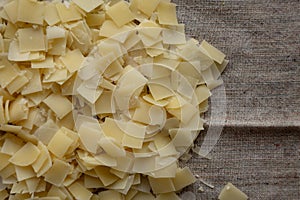 Hard Shaved Parmesan Cheese, top view. Overhead view, flat lay