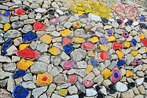 Amazing coloured stones wall: blue, yellow, red, black, grey, violet. photo