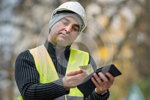 Hard times: poor construction worker and his empty wallet