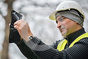 Bad times: poor construction worker and his empty wallet