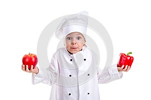 Hard to make a decision. Chef girl in a cap cook uniform with both arms up, holding red bell pepper in one hand and the