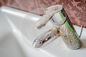 Hard water deposit on a tap