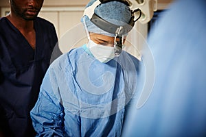 Hard at work in the ER. a team of surgeons performing a surgery in an operating room.