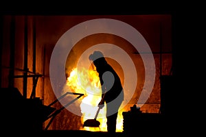 Hard work in a foundry, melting iron