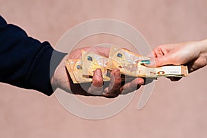 Hard worked hand receiving taking and holding money. World money concept, 50 EURO banknotes EUR currency isolated with copy space
