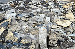 Hardcore waste recycling. Broken concrete slabs at construction site. oncrete rubble from demolition at landfill.  Recycling and
