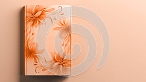 A hardcover note book with a floral design in peach fuzz color on minimal background. Modern trendy tone hue shade