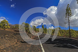 Hardened lava of the volcano on the background of blue sky.