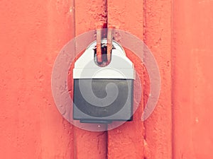 Hardened massive lock  with armor housing. Locked door of garage