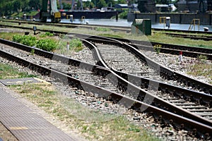 Hardened steel railroad tHardened steel railroad tracks photographed on a sunny spring dayracks photographed on a sunny spring day