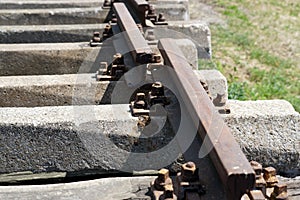 Hardened steel railroad tHardened steel railroad tracks photographed on a sunny spring dayracks photographed on a sunny spring day