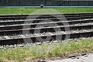 Hardened steel railroad tHardened steel railroad tracks photographed on a sunny spring dayracks photographed on a sunny spring day