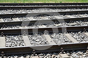 Hardened steel railroad tHardened steel railroad tracks photographed on a sunny spring dayracks photographed on a sunny spring day