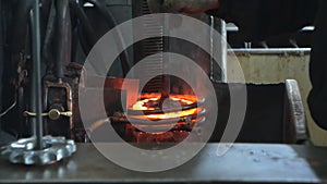 Hardening and heat treatment of the metal gear of the part on the equipment for hardening of metal products, heat