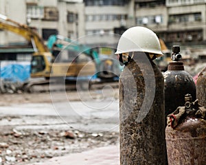 Hardhat on a gas cylinder at a construction site