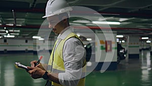 Hardhat man working parking writing folder alone closeup. Inspector checking