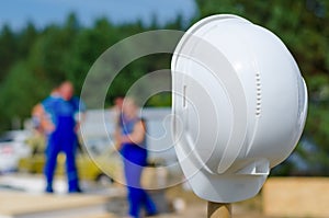 Hardhat on a pole at a building site